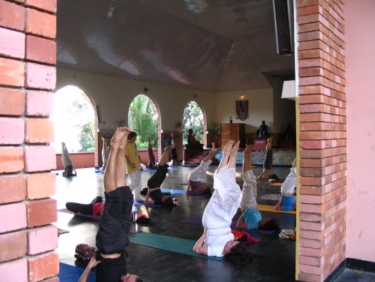 Practicing the shoulderstand in the main hall.