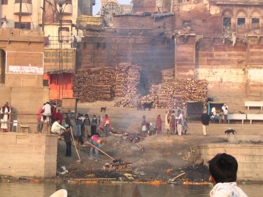 A burning ghat, the wood piled up behind cremations (nobody is burning here, it is illegal to take pictures if they are)