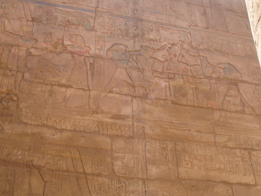 Scene on the side of the wall. Every available surface of most temples and tombs I have seen are decorated. For the temples, many have to do with the brave exploits of whichever Pharaoh commissioned the work, or their divinity.