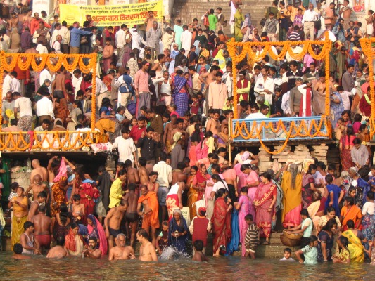Ritual bathing (puja) in the Ganga, early morning.